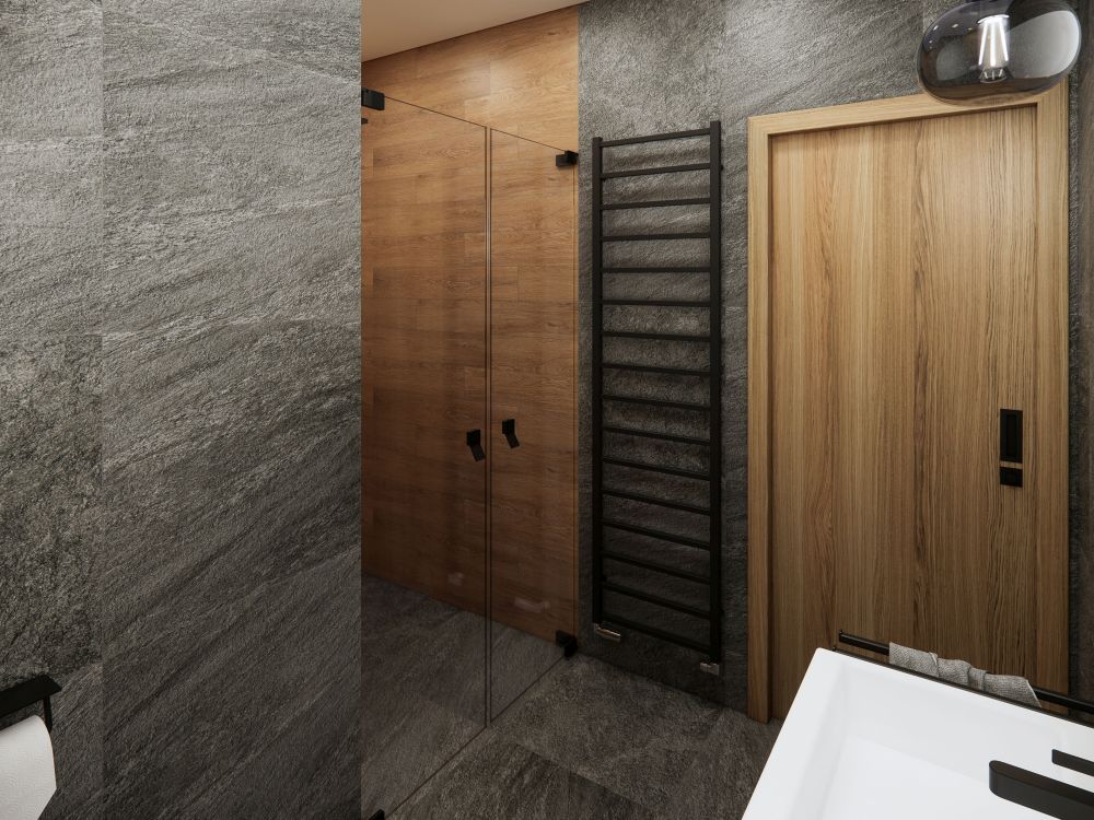 Návrh dvou elegantních koupelen a WC: velkoformátové obklady v imitaci přírodních materiálů, kvalitní sanita a černé doplňky 5