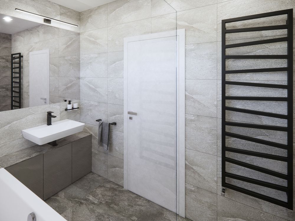 Návrh dvou elegantních koupelen a WC: velkoformátové obklady v imitaci přírodních materiálů, kvalitní sanita a černé doplňky 10