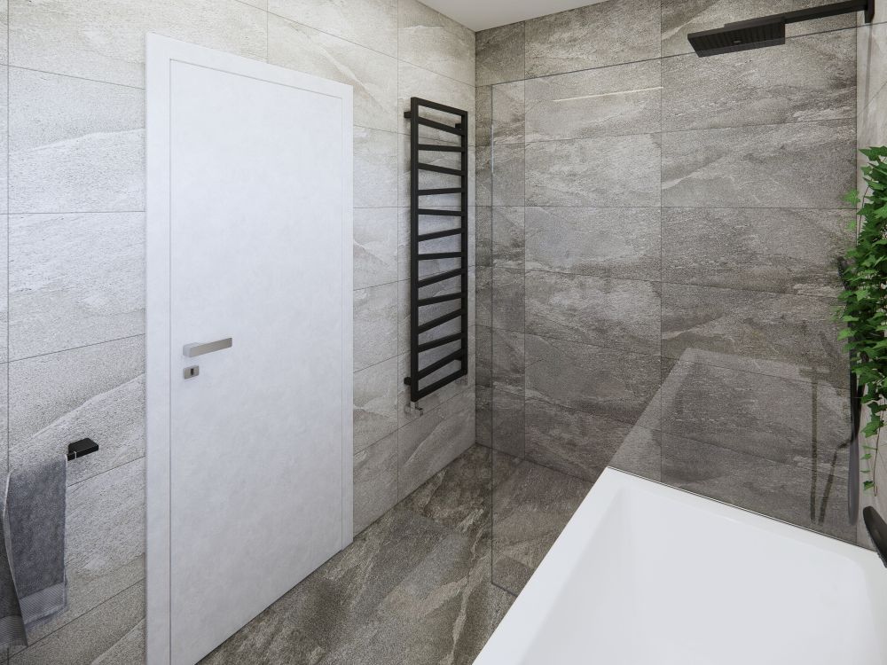 Návrh dvou elegantních koupelen a WC: velkoformátové obklady v imitaci přírodních materiálů, kvalitní sanita a černé doplňky 12
