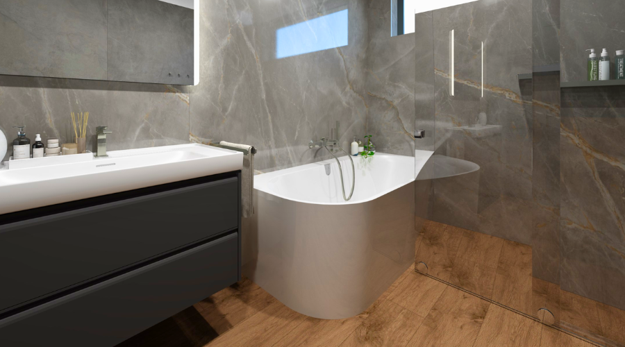 Moderní koupelna s obklady Atlas Concorde, volně stojící vanou Villeroy & Boch a zrcadlem Nimco v realizaci na Moravě. 